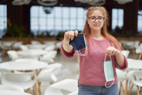 Young Woman Shows Choosing Reusable Face Mask And Refuses Disposable