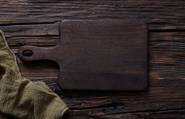 Cutting board on dark wooden table