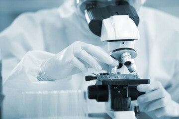 Laboratory research. Team work Scientists  study data and evaluating microscope success. they are...