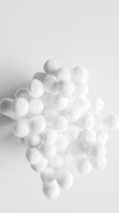 Close-up photo of white cotton swabs and white cotton swabs on isolated white background.