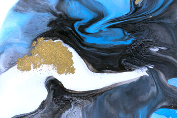 Black, blue and gold marbling pattern. Dark marble liquid texture.