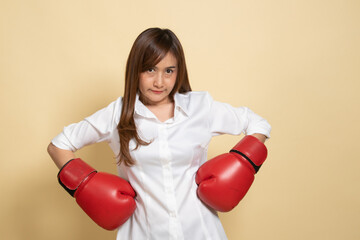 Young Asian woman with red boxing gloves.