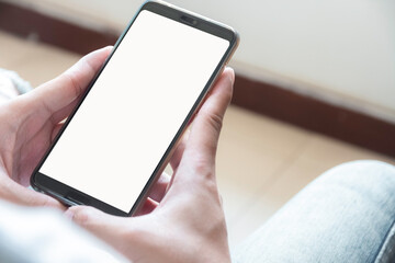 close up of boy's hands is using smart phone with blank screen.
