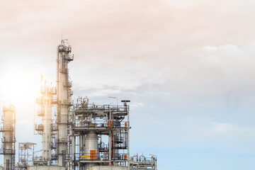 Industrial of oil refinery plant from industry zone ,Refinery factory oil storage tank and pipeline steel with sunset sky.