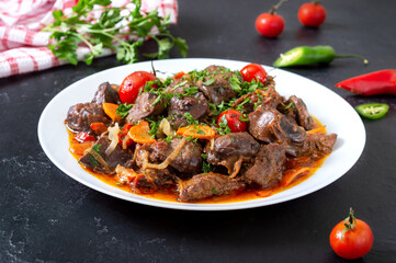 Roast offal with vegetables. Armenian dish Kuchmachi.