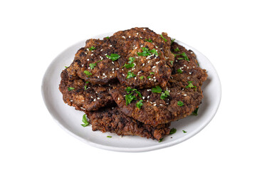 Fried liver pieces on a plate isolated on a white background