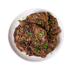 Fried liver pieces on a plate isolated on a white background. Top view.
