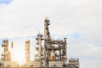 Industrial of oil refinery plant from industry zone ,Refinery factory oil storage tank and pipeline steel with blue sky.