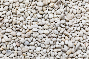 White pebble stones or gravel on floor seamless texture