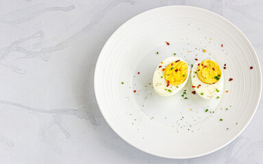 Sliced Boiled Eggs on a White Plate Top Down Flat Lay Food Photo