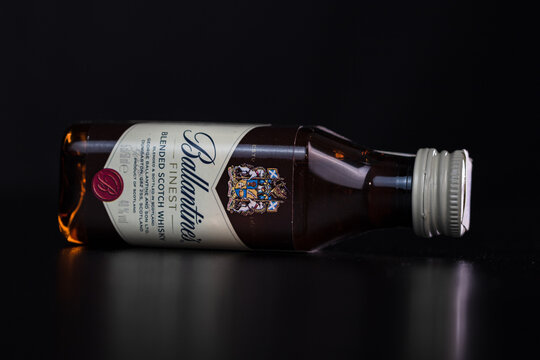 Selective focus, close up of Ballantine's Scotch whiskey mini bottle isolated. Bucharest, Romania, 2021