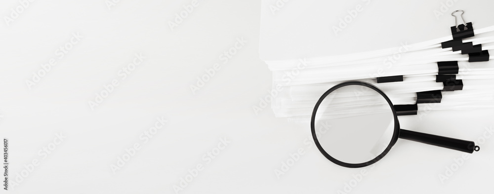 Poster stack of report paper documents with magnifying glass. concept of business and search.
