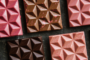 Handmade chocolate with pieces of freeze-dried fruit and dry ice cream