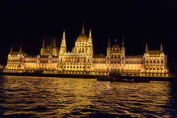 Fototapeta premium Night view of the most beautiful building of the Hungarian Parliament from the Danube River. City of Budapest, Hungary, night.
