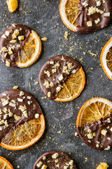 Milk chocolate candies lie on a black table