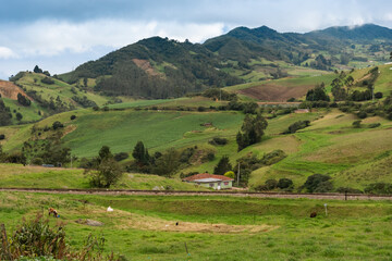 Fototapeta na wymiar Country landscape in Boyaca, Colombia with mountains house and train track