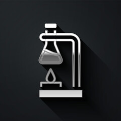 Silver Glass test tube flask on fire heater experiment icon isolated on black background. Laboratory equipment. Long shadow style. Vector.