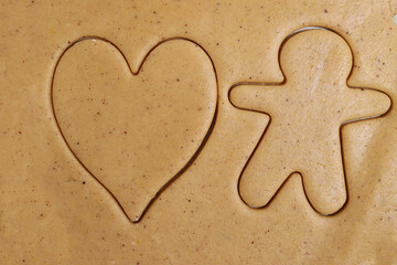 heart and man shaped cutting moldon rolled dough
