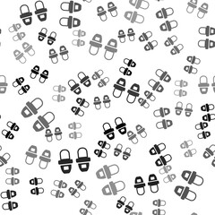 Black Hotel slippers icon isolated seamless pattern on white background. Flip flops sign. Vector.