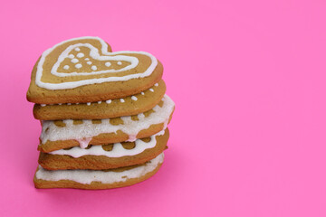 Stack of Gingerbread cookies hearts on pink background