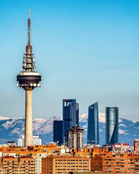 Skyline of Madrid city, with snowy mountains background