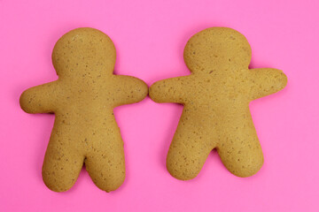 gingerbread men on a pink background