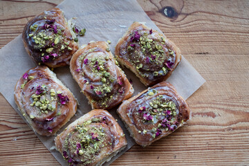 High angle close up of freshly baked Danish Pastries with Pistachio Nuts.