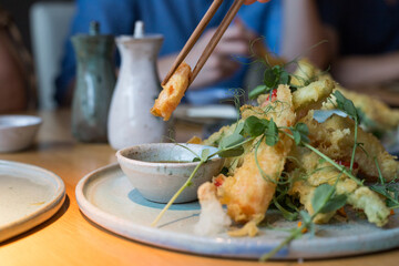 Chicken in tempura on a table in a restaurant.