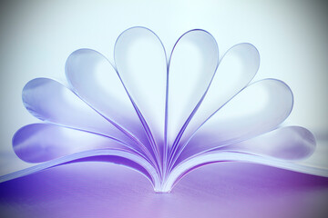 Book pages in heart shape. Book lover or love reading concepts.