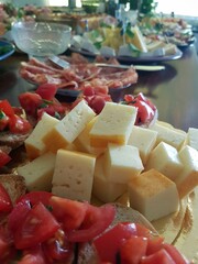 Sheep's cheese cut into cubes at a buffet