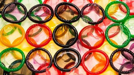 Colorful condoms background.