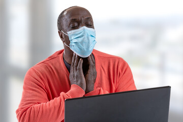 Telemedicine concept - African male patient consult her health condition to doctor in front of...
