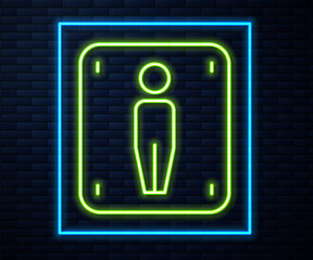 Glowing neon line Male toilet icon isolated on brick wall background. WC sign. Washroom. Vector.