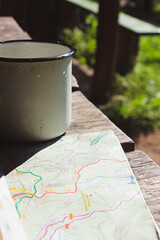 map and a cup on a table