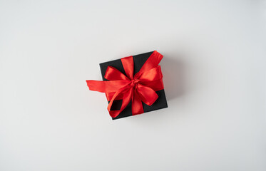 Black gift boxes with red ribbon on white background. The Concept Of Valentine's Day.