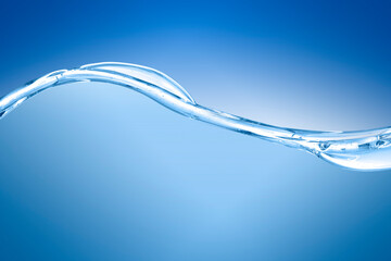 blue water surface with splash, waves and air bubbles on blue background