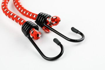Elastic rubber rope with hook on the end on a white background