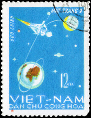 Postage stamp issued in the Vietnam with the image of the Luna 9 on its flight path to the moon....