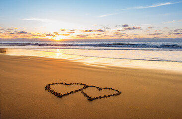 Couple hearts on sea beach. Valentine day and love concept