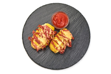 Baked stuffed potatoes with cheese and salami, isolated on white background