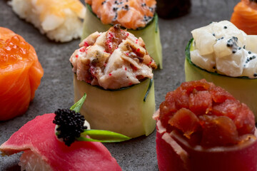 Sushi set to roll and nigiri with tuna, salmon, rice caviar, and Philadelphia cheese