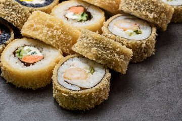 Set hot sushi roll with shrimp, snow crab, salmon, Philadelphia cheese and tempura