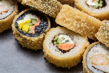 Set hot sushi roll with shrimp, snow crab, salmon, Philadelphia cheese and tempura