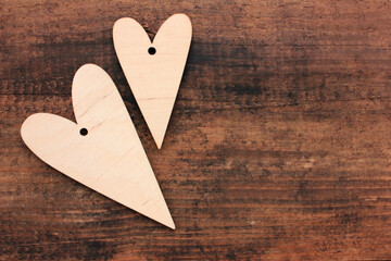Blank wooden hearts for painting or decoupage on wooden table background. Top view. Valentines day...