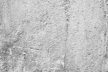 Texture of a concrete wall with cracks and scratches which can be used as a background