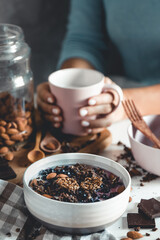 Fruit plate with granola. Exotic fruits. Woman healthy breakfast