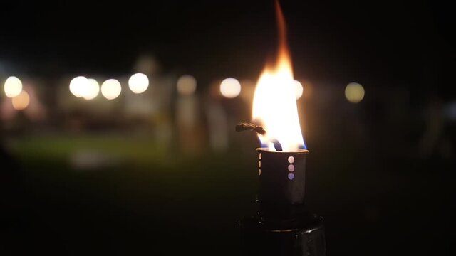 fire torch flame outdoor garden at night slow motion