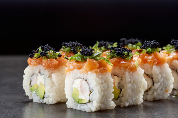 Sushi with shrimp, salmon, rice, Philadelphia cheese, and tobiko