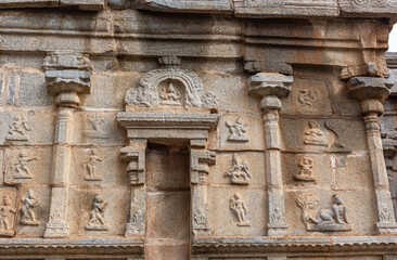 Hampi, Karnataka, India - November 5, 2013: Sri Krishna temple in ruins. Brown-beige stone facade...