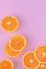 orange slices on pink background.top view  food.